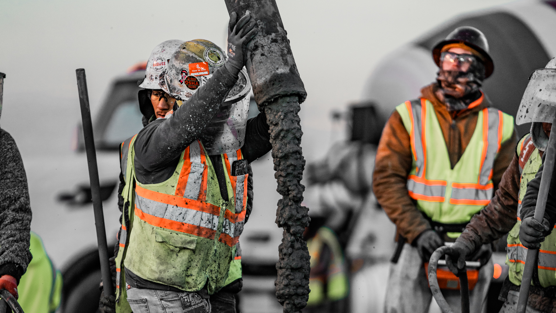 Impact Concrete crew guiding the pump hose during a concrete placement